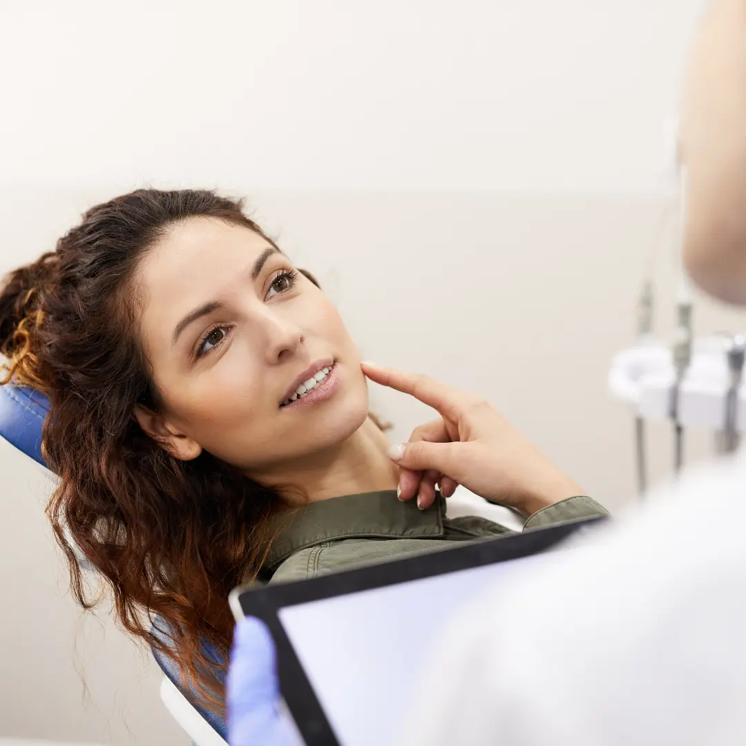 Boston orthodontist showing clear aligners to patient