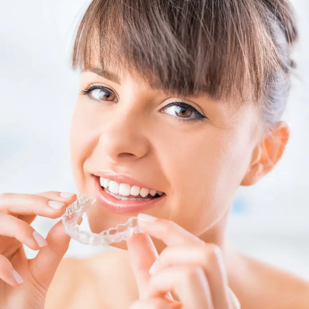 Boston patient showing off straightened teeth after clear braces